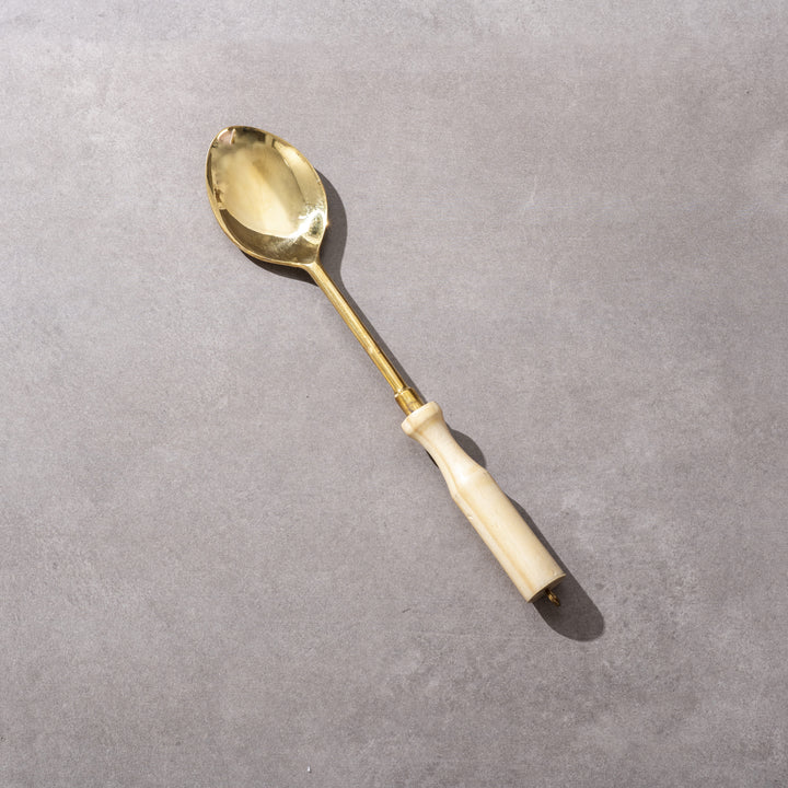 Brass curved spoon